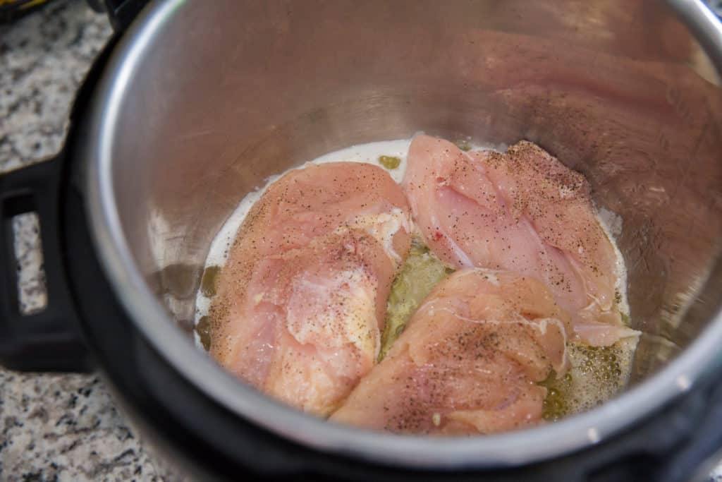 raw chicken breasts sauteed in butter in the instant pot