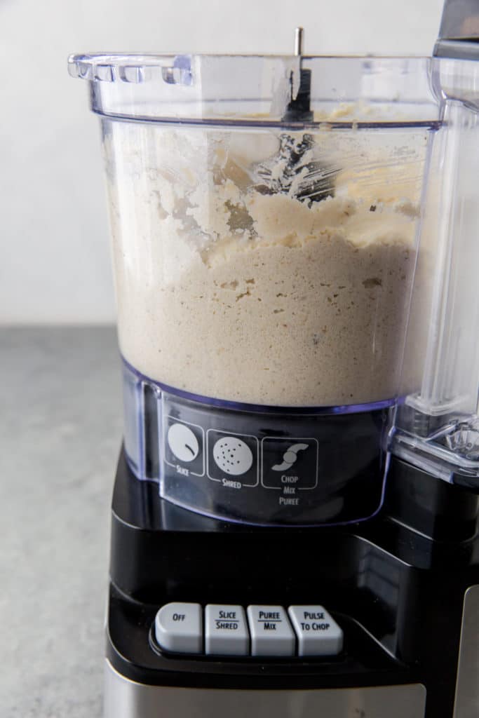 Cauliflower hummus cauliflower hummus pureed in a food processor