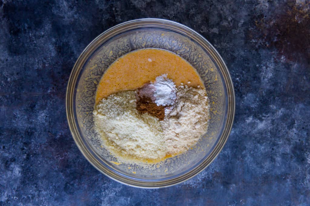 mixing bowl with pancake batter ingredients