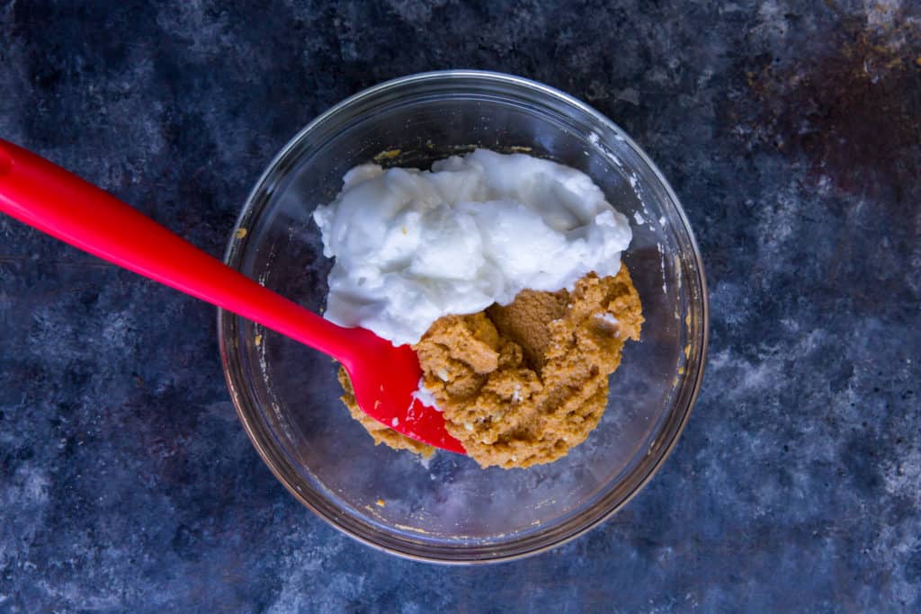 keto pumpkin pancakes folding egg whites into batter for fluffy pancakes