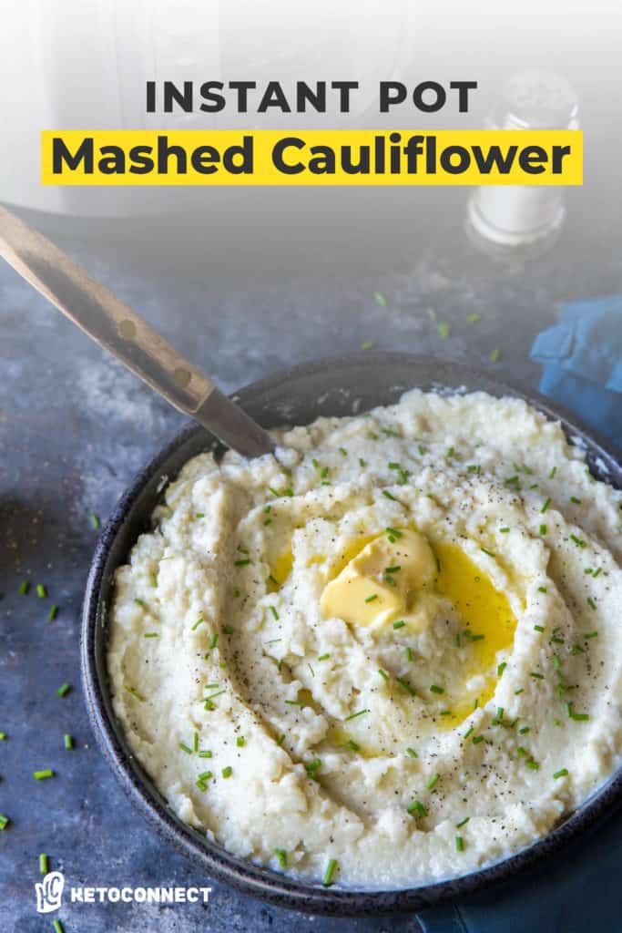 cauliflower mashed potatoes placed in a serving dish and topped with butter