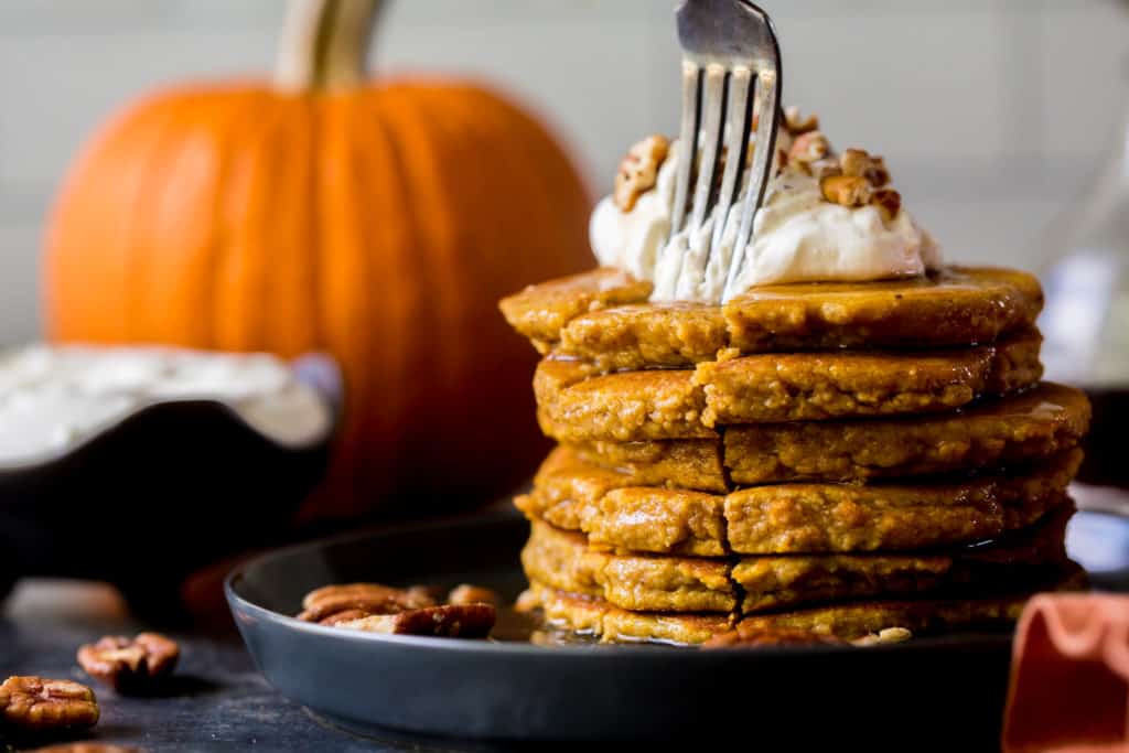 pumpkin pancakes sliced with a fork