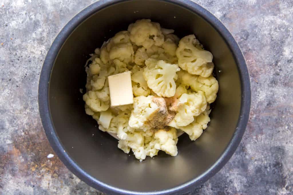 cauliflower mashed potatoes ingredients being added together