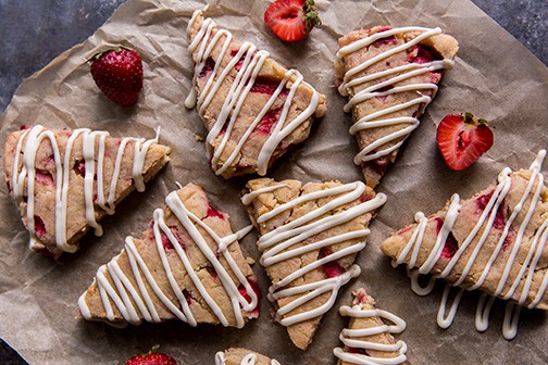 keto scones finished pastries with strawberries on parchment paper