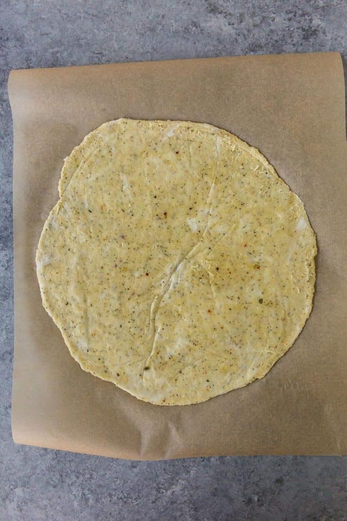 keto pizza formed and flattened ready to bake