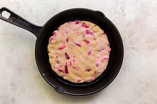 cast iron with flattened dough