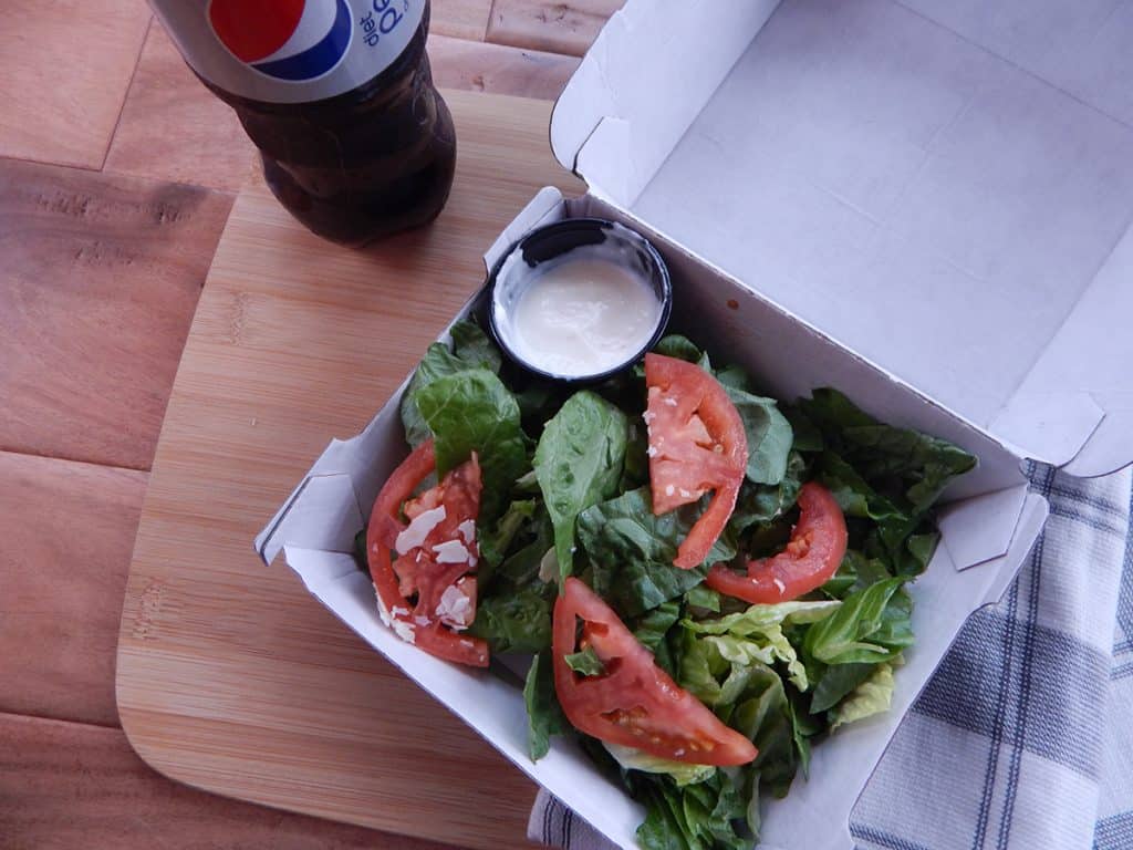 Garden Salad next to a diet pepsi