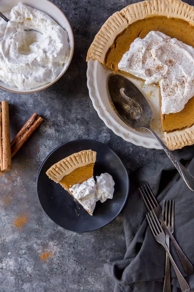 keto pumpkin pie serving spoon and slice on a plate for dessert
