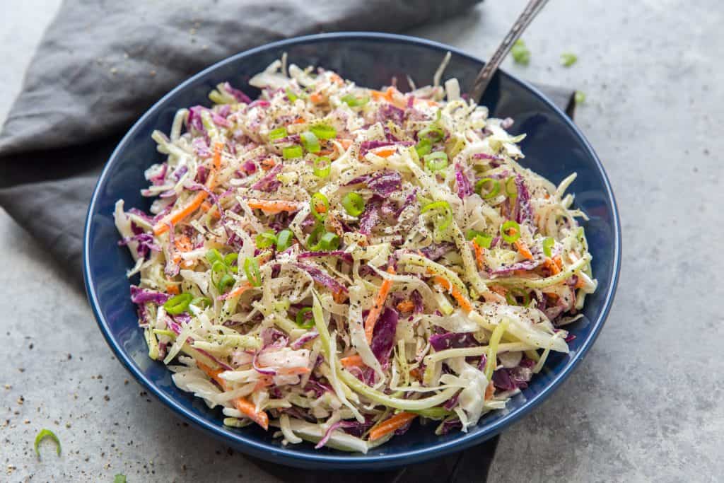 close up bowl of keto coleslaw on a table