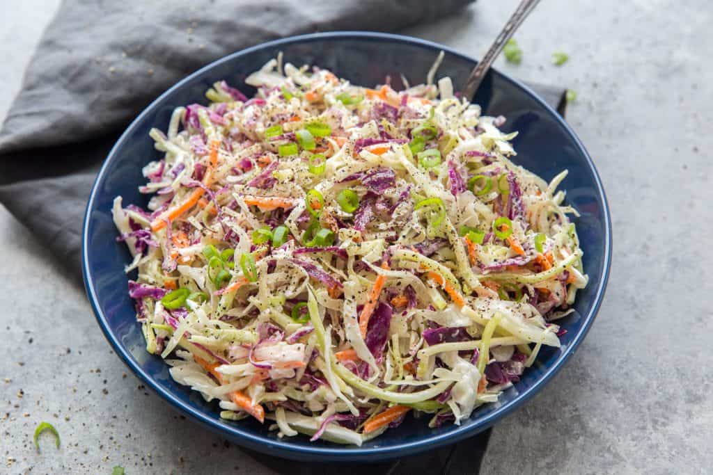 keto coleslaw close up bowl of keto coleslaw on a table