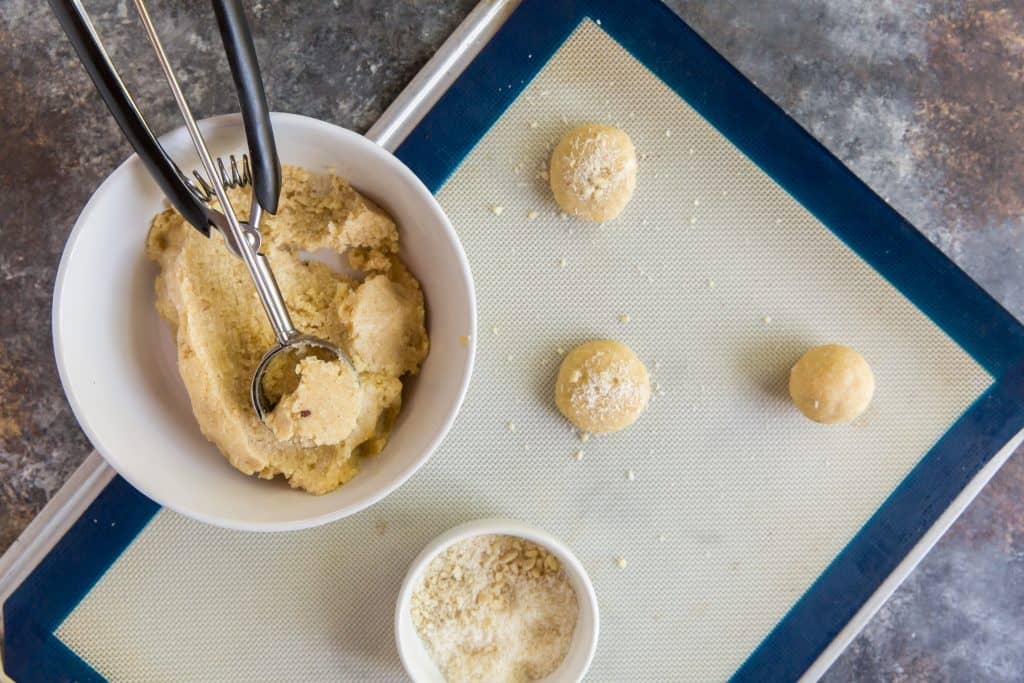 Keto Oatmeal Cookies Using a cookie scoop to make even balls on a silpat mat.