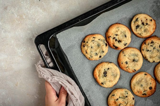 Freshly baked cookies coming out of the oven in perfect rows