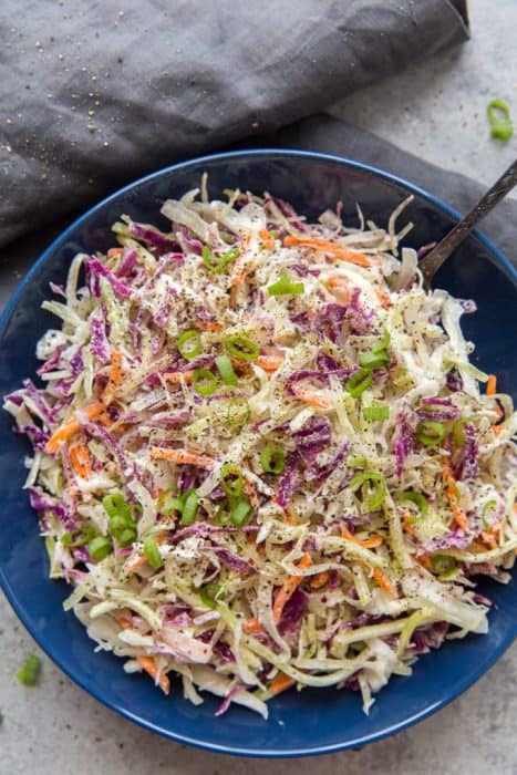 keto coleslaw in a bowl with a serving spoon