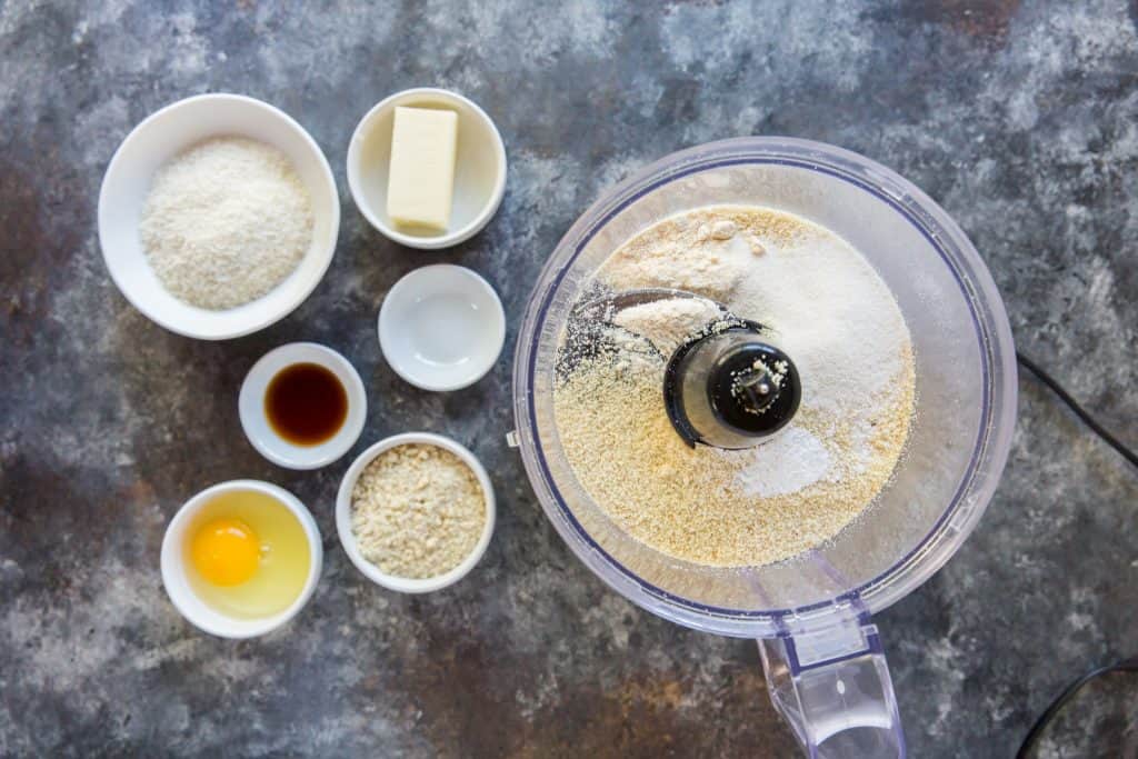Keto Oatmeal Cookies Food processor next to the ingredients to make oatmeal cookies