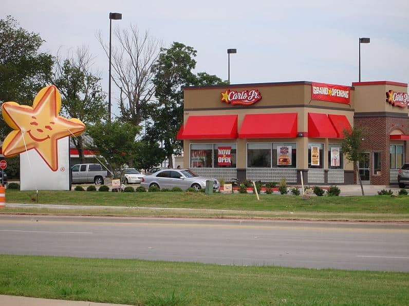front of a grand opening at a carls junior restaurant