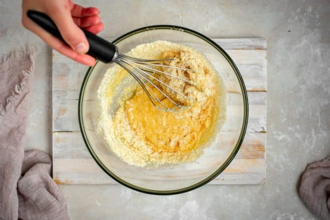 Whisking the dry and wet ingredients together 