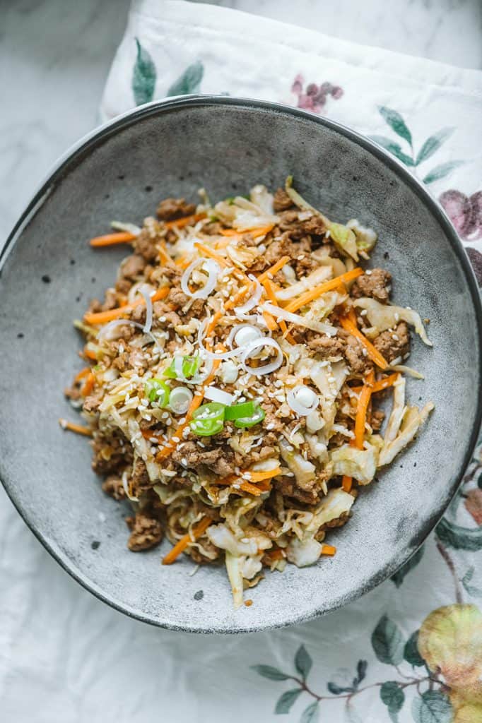 Keto Egg Roll In A Bowl Egg roll in a bowl plated in a grey ceramic bowl a top a linen towel