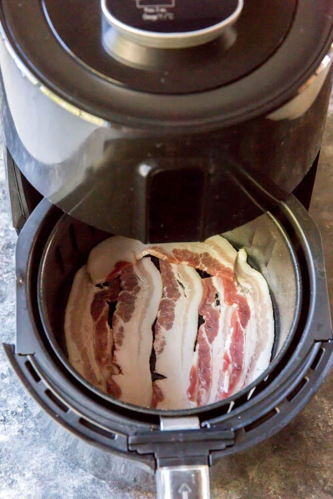 Air fryer bacon Bacon going into the air fryer