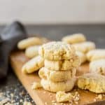 Oatmeal cookies stacked on a cutting board