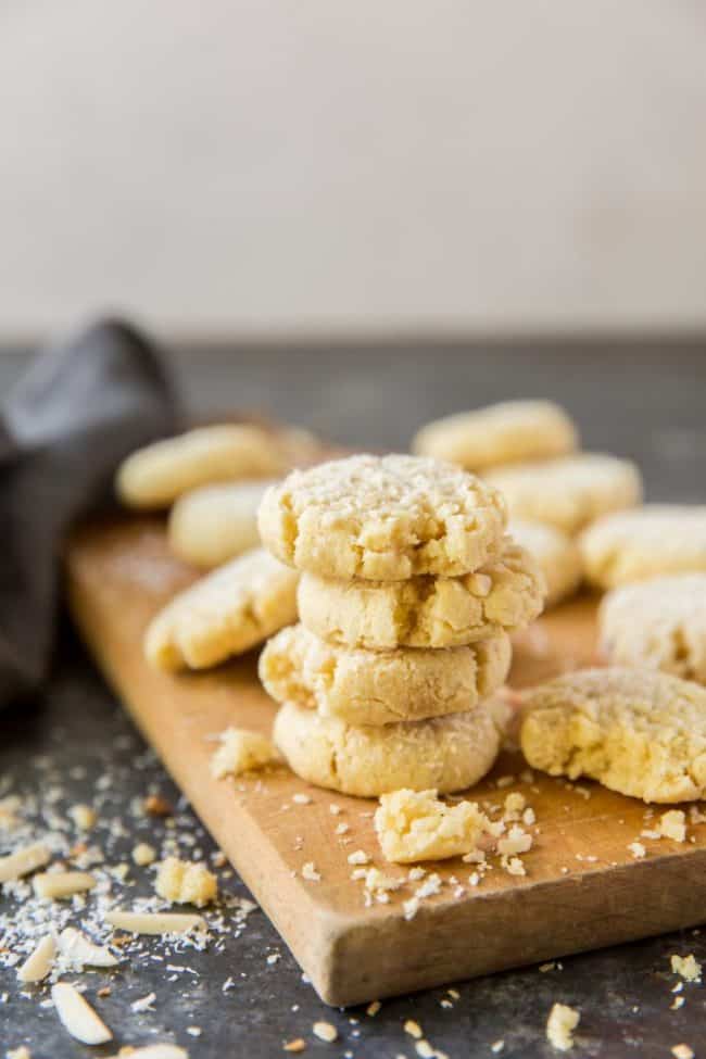 Oatmeal cookies stacked on a cutting board