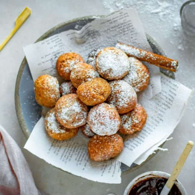Keto Donuts fried keto doughnuts topped with sugar next to chocolate