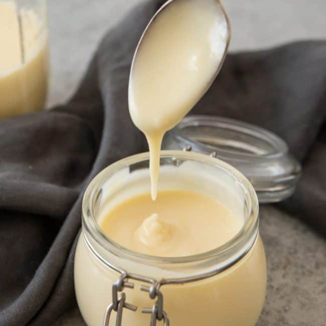 Keto Condensed Milk Thick condensed milk being drizzled