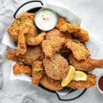 A horizontal shot of finished keto fried chicken in a basket