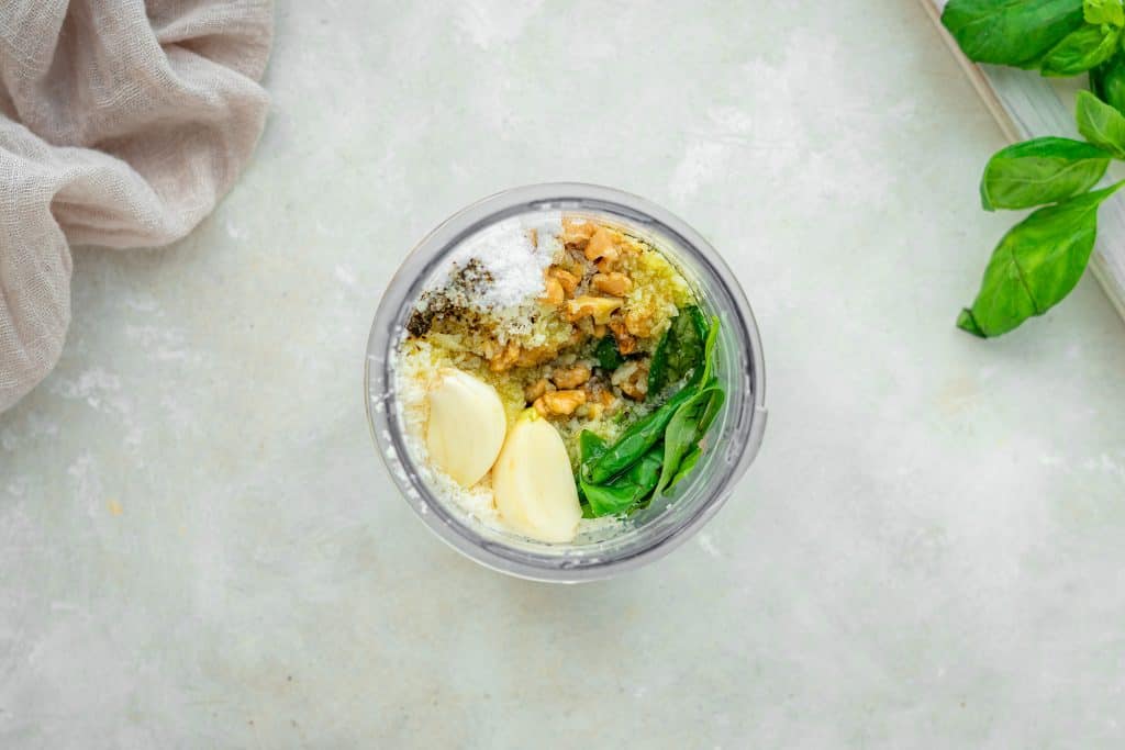 Keto Pesto all ingredients added to a food procesor