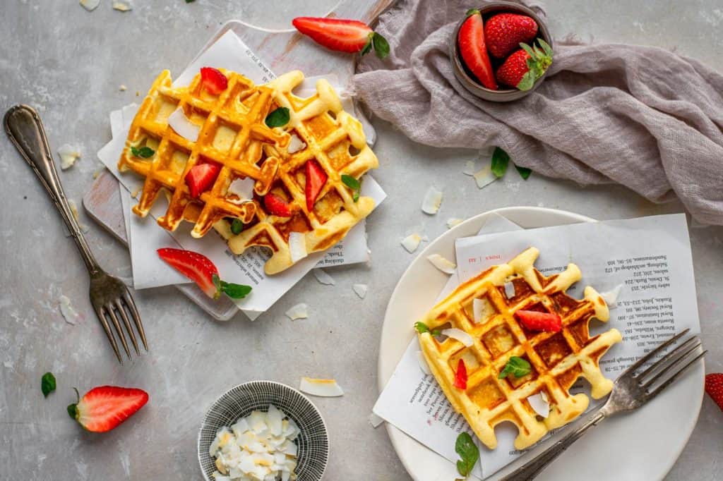 Keto protein waffles plated and topped so they are ready to serve. 