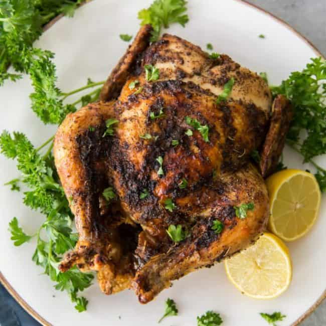 Air Fryer Whole Chicken Vertical shot of plated air fryer chicken