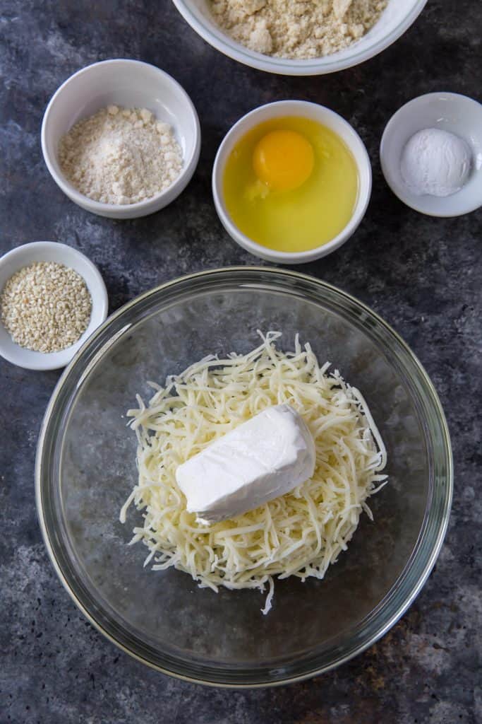Keto Hamburger Buns putting cream cheese into the shredded cheese