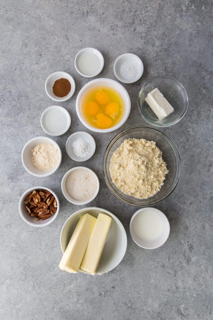 ingredients for keto banana bread in ceramic and glass bowls