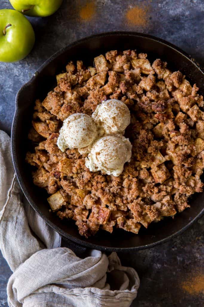 A close up of the keto apple crisp with ice cream