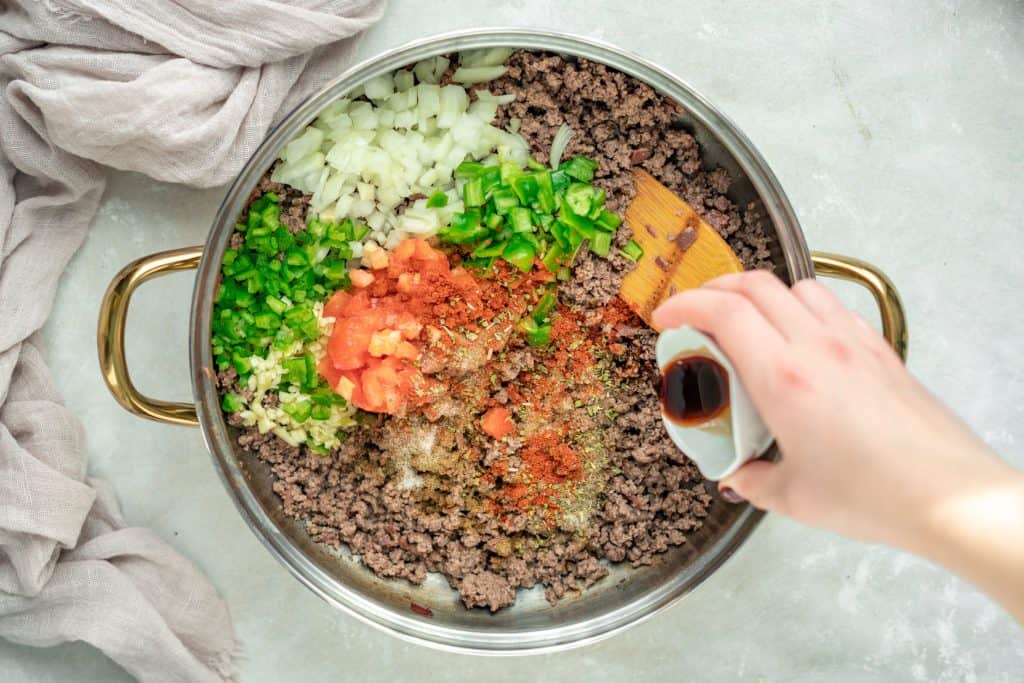 A pot full of herbs and spices to make keto chili