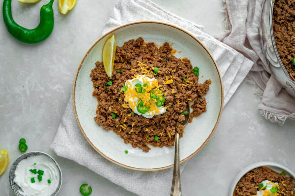 A shallow ceramic plate filled with keto chili 