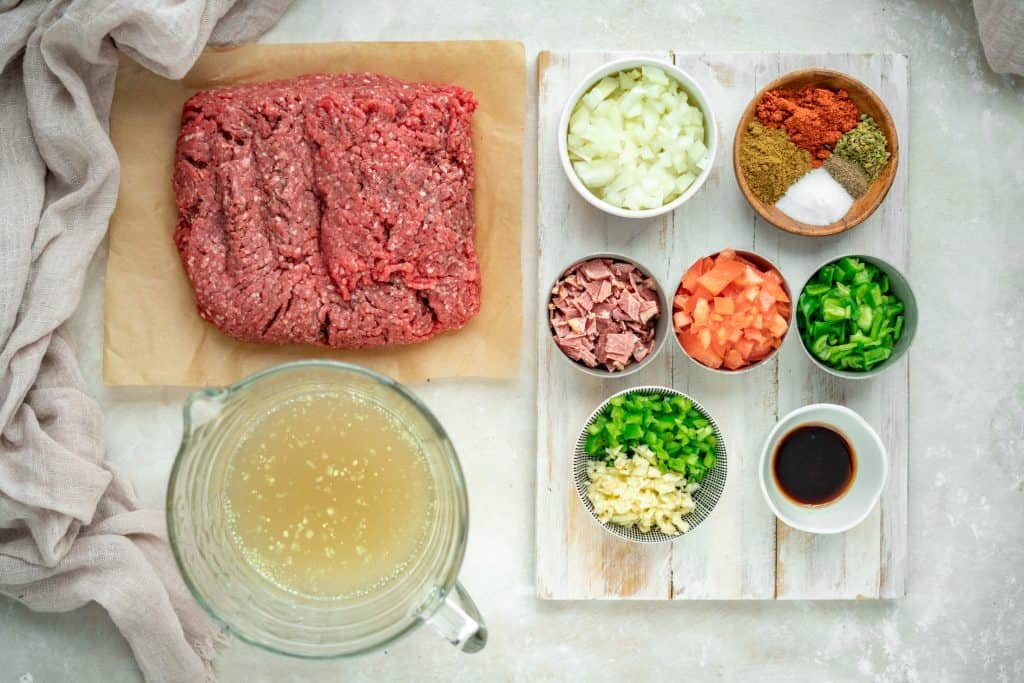 Bowls and ramekins of ingredients to make keto chili