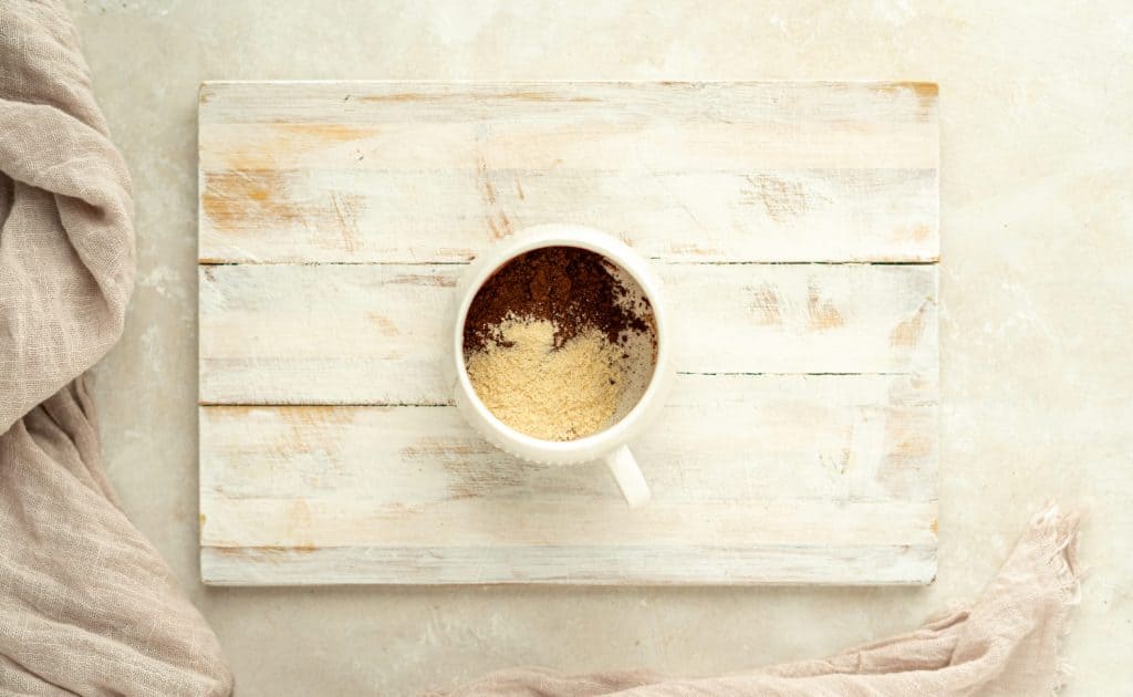Keto Mug Brownie dry ingredients in a white mug