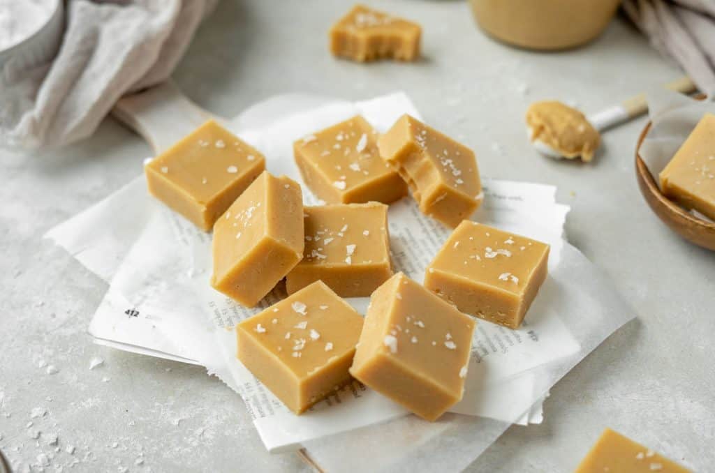 Square slices of peanut butter fudge set center stage. 