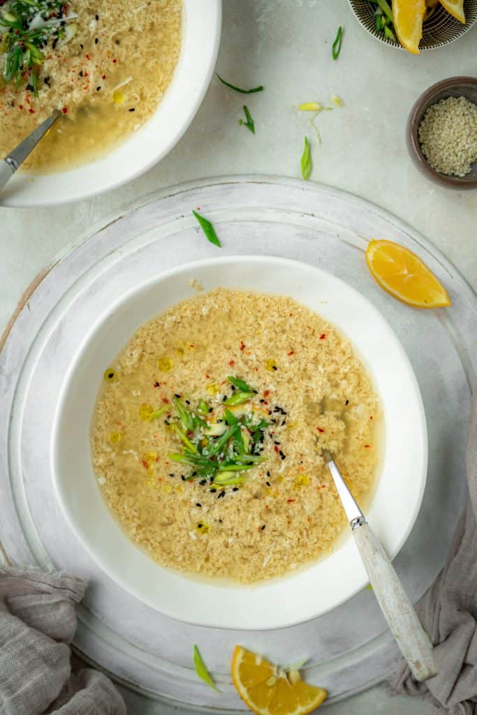 Rustic serving tray with a bowl of egg drop soup 