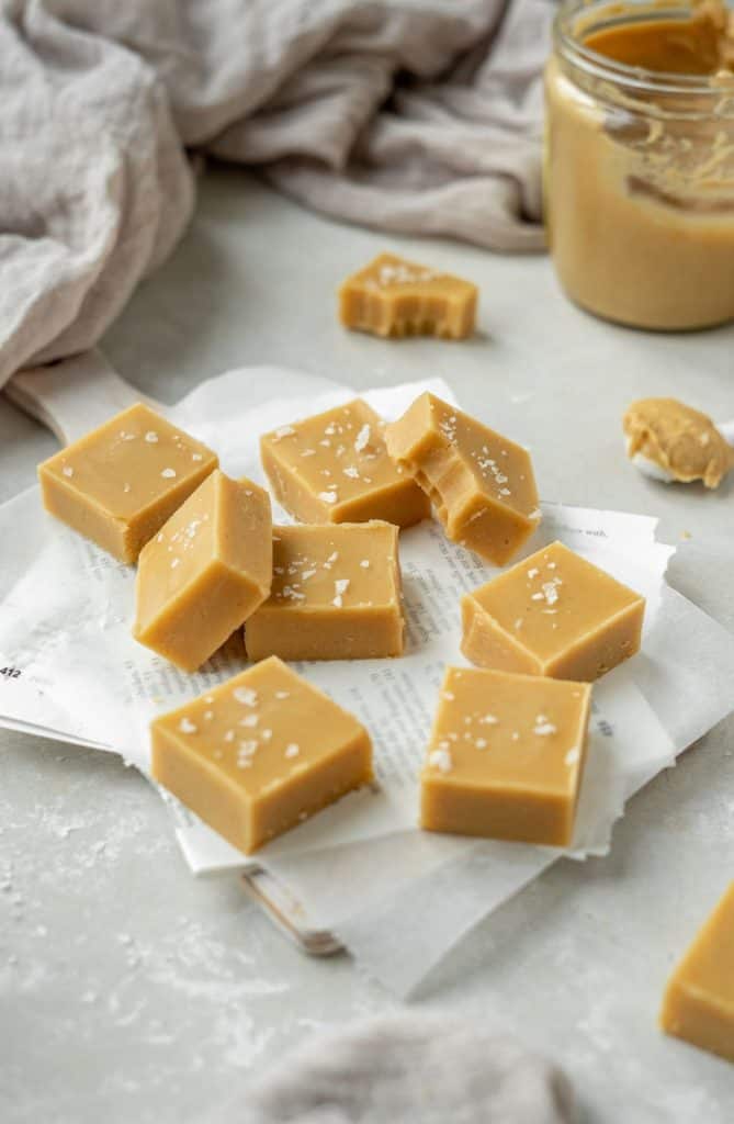 keto peanut butter fudge caramel colored sliced of peanut butter fudge sprinkled with salt