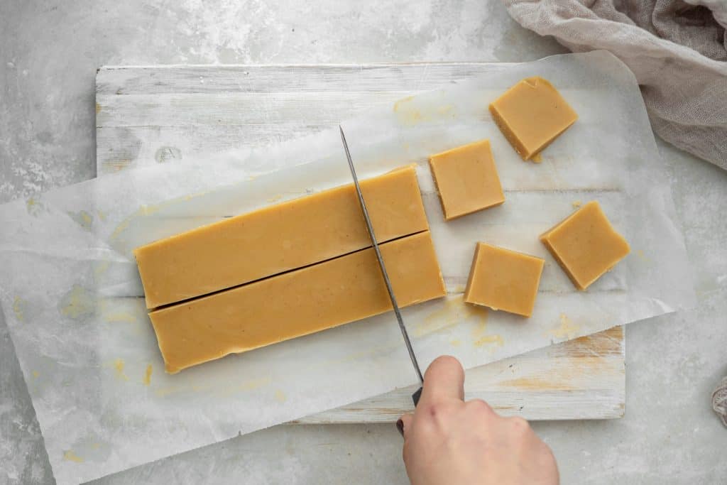 keto fat bombs slicing peanut butter fudge