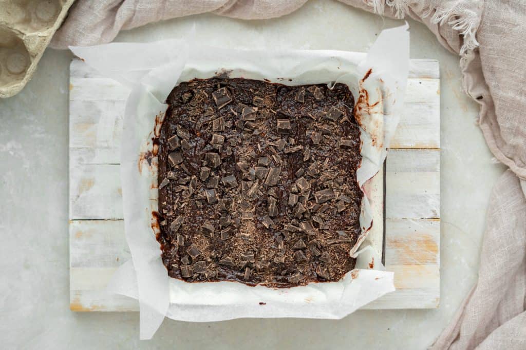 Keto Avocado Brownies Brownie batter in a baking dish