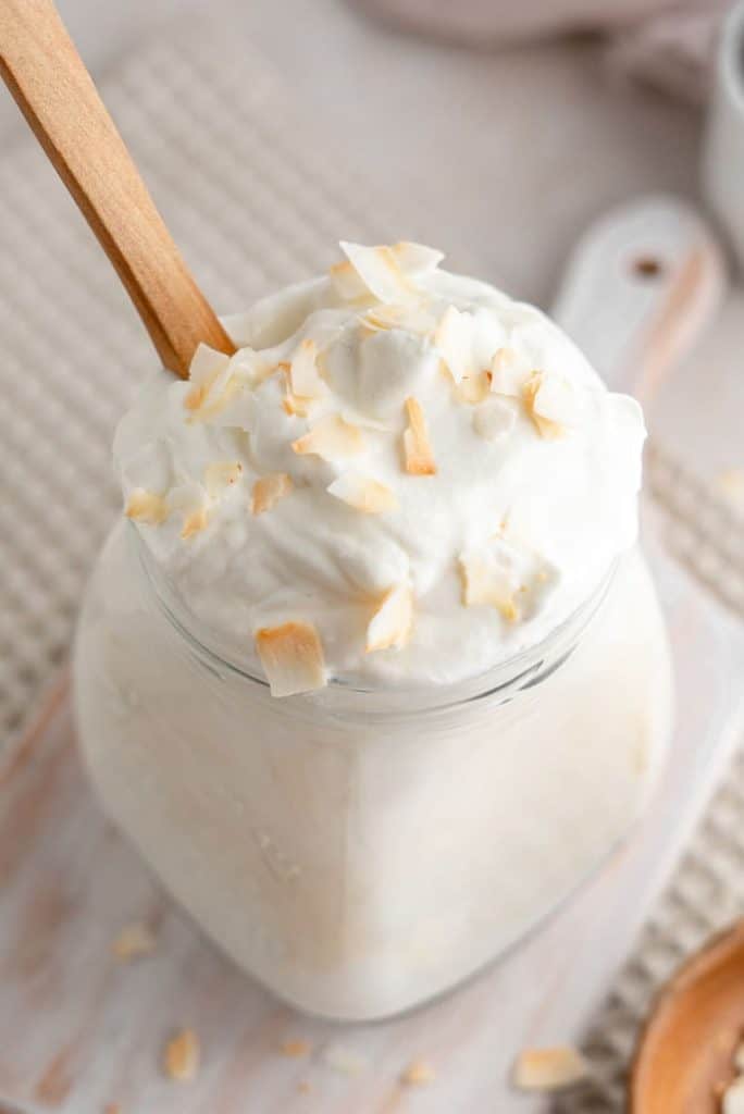 Keto Yogurt A close shot of creamy white yogurt and toasted coconut
