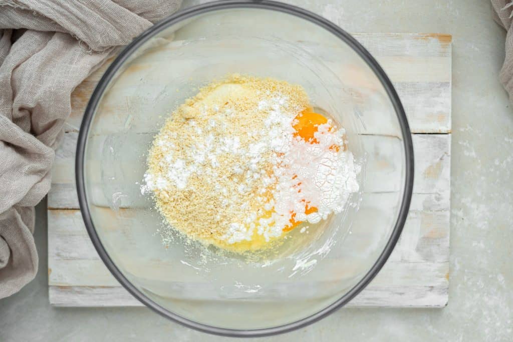 keto bagels adding the egg and flour to the melted cheeses