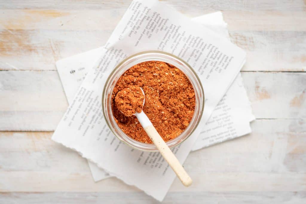 Keto taco seasoning A mini wooden spoon inside of taco seasoning