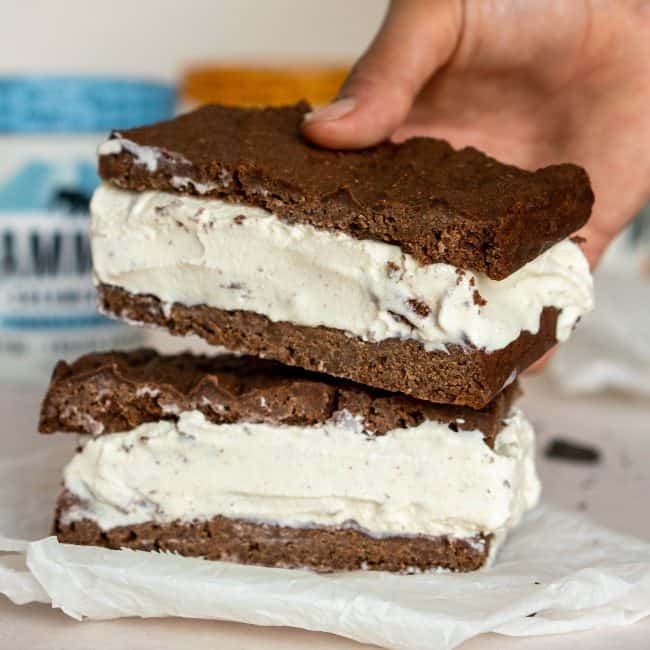 Keto Ice Cream Sandwich hand placing a second ice cream sandwich on top of the first