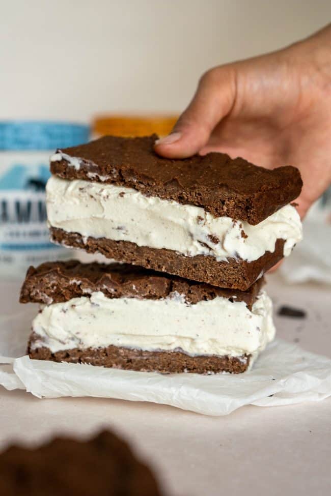 hand placing a second ice cream sandwich on top of the first