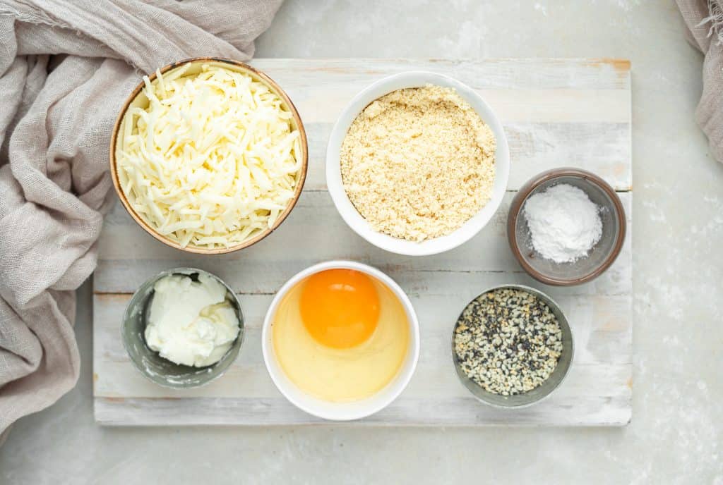 all the ingredients needed for this bagel recipe on a cutting board