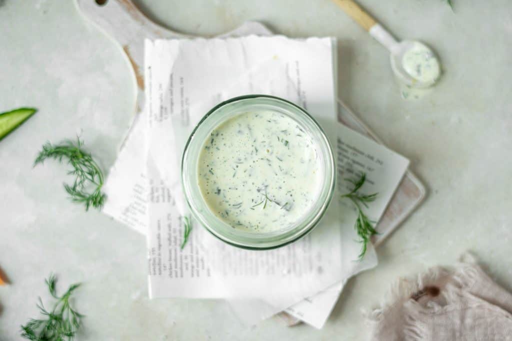 Sprigs of dill around ranch dressing