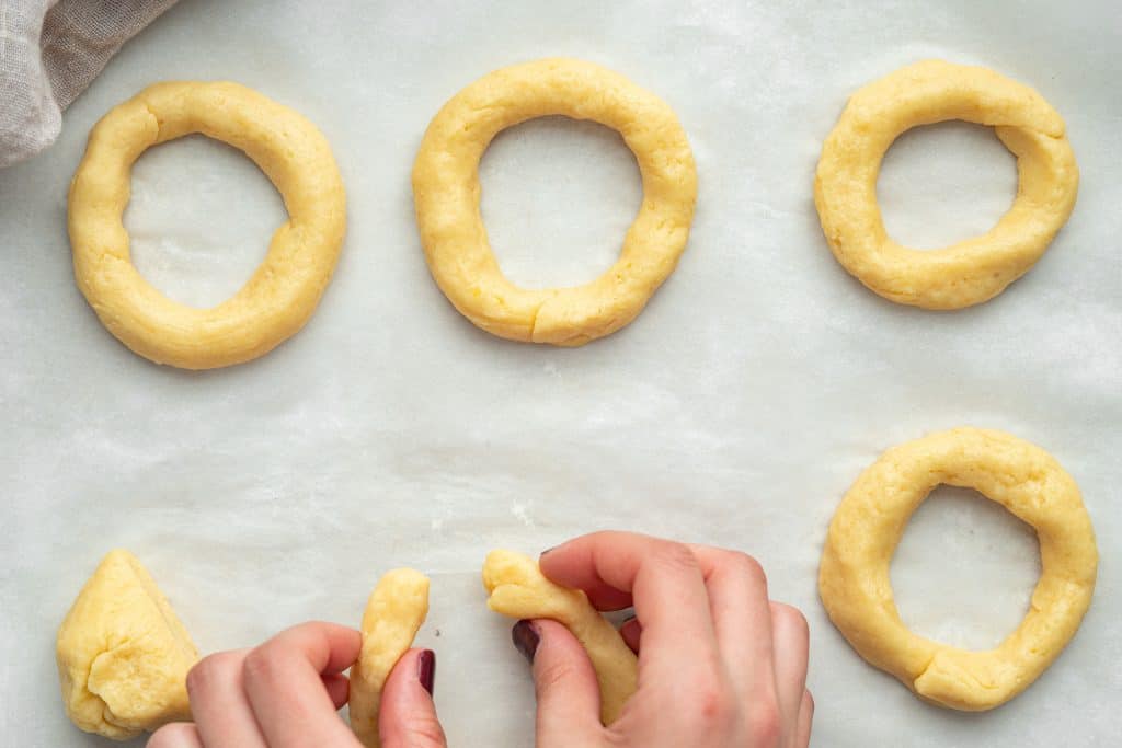 forming the bagels by hand from the six pre portioned pieces